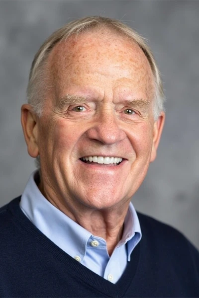 Headshot of Terre Harris in dark-blue sweater and light-blue collard under shirt.